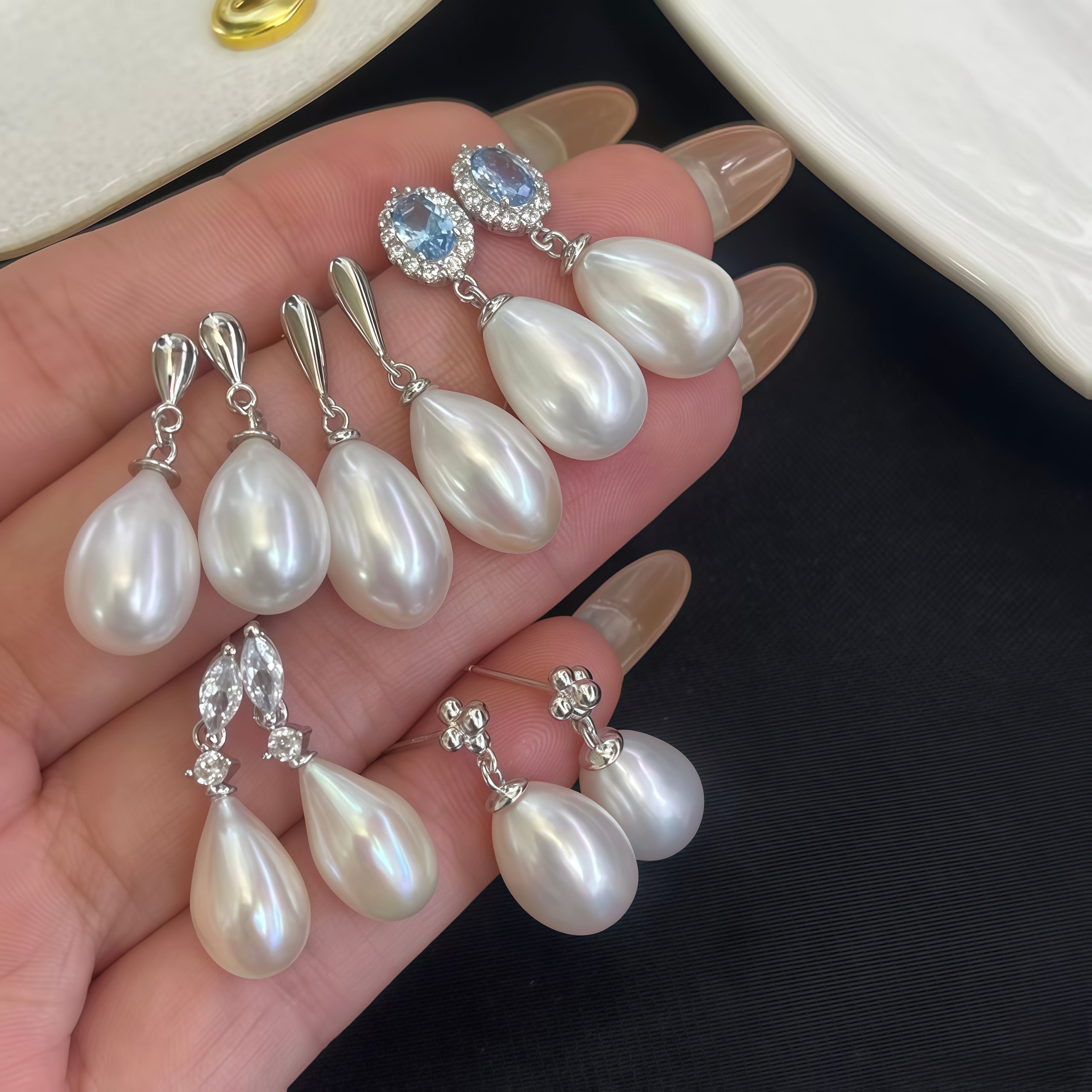 Pearl bridal earrings guide showing pearl studs, pearl drop earrings, pearl dangle earrings, pearl hoops, and pearl and diamond earrings for wedding looks