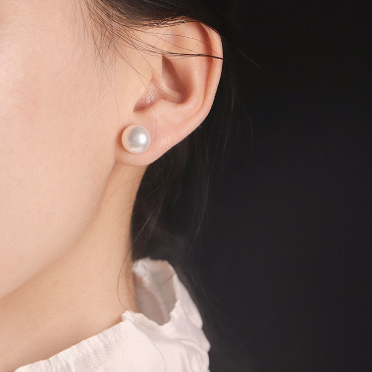 Freshwater pearl stud earrings worn on model, timeless and elegant everyday jewelry