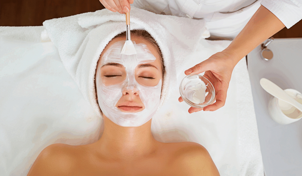 A cream cosmetic mask being applied with a brush, illustrating a cosmetic formulation application